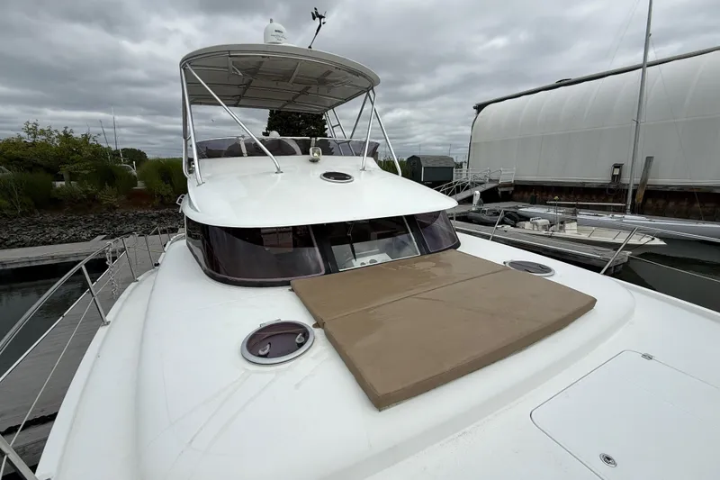 Slide: The Image of 2015 Fountaine Pajot Summerland 40 LC yacht docked, featuring spacious deck and sleek design. - 25