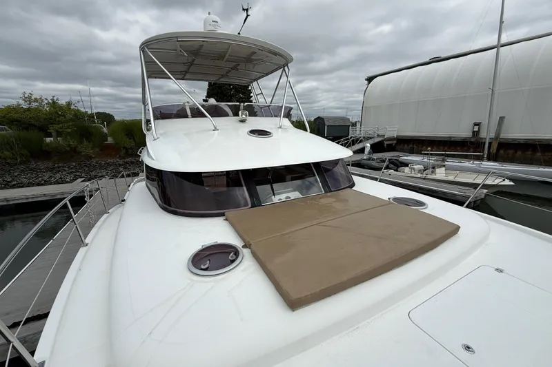 Slide: The Image of 2015 Fountaine Pajot Summerland 40 LC yacht docked at marina under cloudy sky. - 26