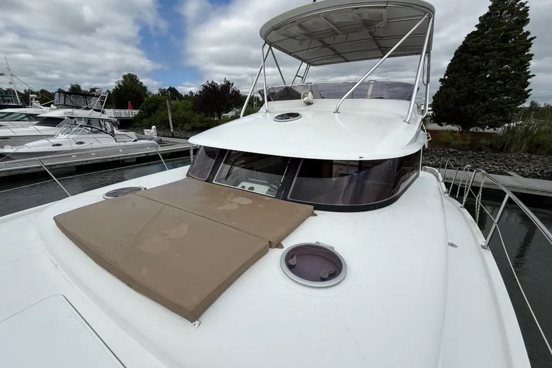 Slide: The Image of 2015 Fountaine Pajot Summerland 40 LC yacht docked, featuring spacious deck and canopy. - 31