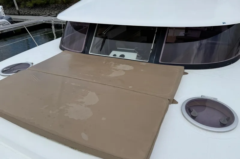 Slide: The Image of 2015 Fountaine Pajot Summerland 40 LC yacht with cushioned deck and portholes. - 32