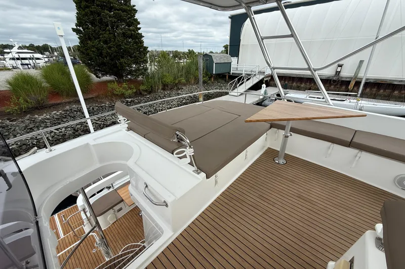 Slide: The Image of 2015 Fountaine Pajot Summerland 40 LC yacht deck with seating and table. - 35