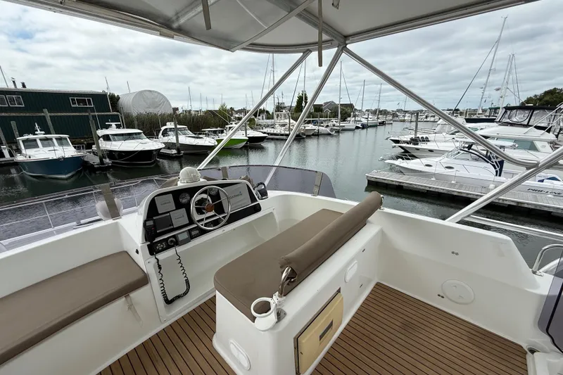 Slide: The Image of Flybridge view of 2015 Fountaine Pajot Summerland 40 LC in marina setting. - 36
