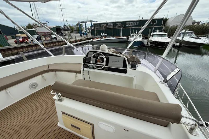 Slide: The Image of Flybridge of 2015 Fountaine Pajot Summerland 40 LC with helm and seating area. - 39