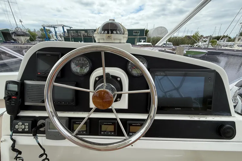 Slide: The Image of Helm of 2015 Fountaine Pajot Summerland 40 LC with navigation instruments and steering wheel. - 42