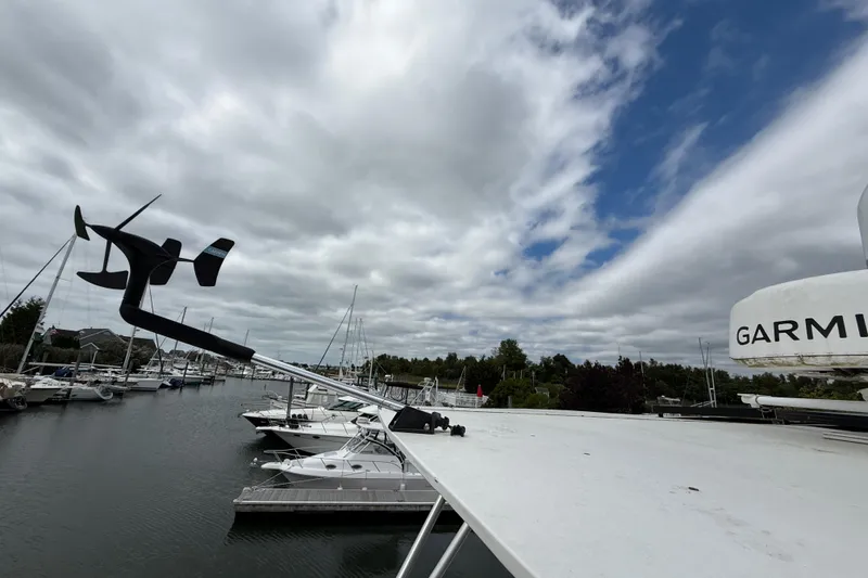 Slide: The Image of 2015 Fountaine Pajot Summerland 40 LC at marina with cloudy sky and Garmin equipment. - 50