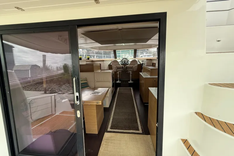 Slide: The Image of Interior view of 2015 Fountaine Pajot Summerland 40 LC yacht, featuring modern seating and helm. - 53