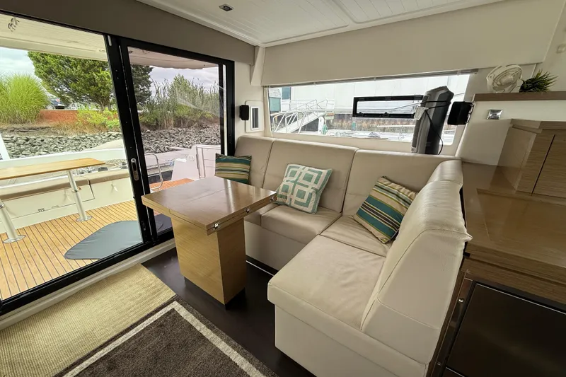 Slide: The Image of Interior of 2015 Fountaine Pajot Summerland 40 LC with cozy seating and table. - 59