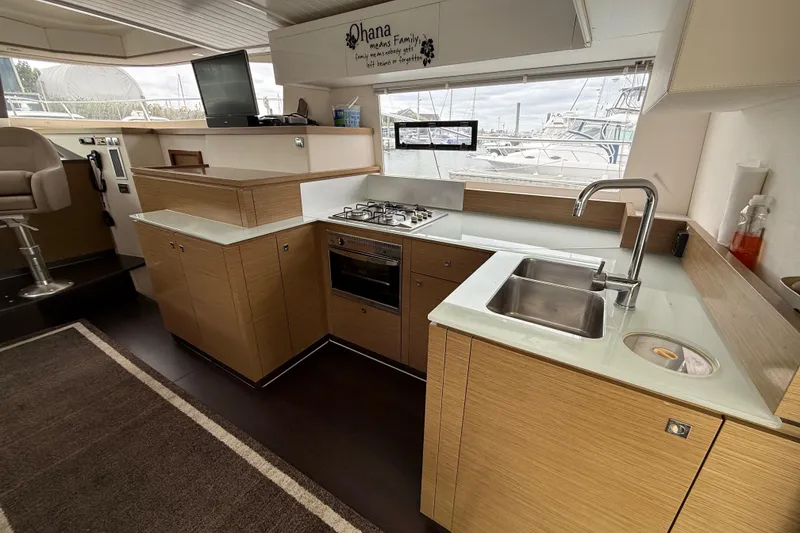 Slide: The Image of Modern kitchen interior of 2015 Fountaine Pajot Summerland 40 LC yacht with wood cabinetry. - 70