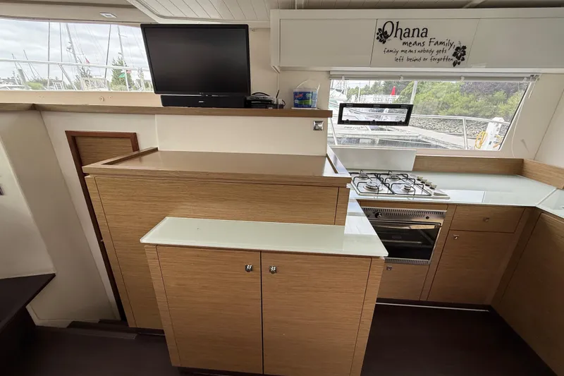 Slide: The Image of Interior of 2015 Fountaine Pajot Summerland 40 LC yacht kitchen with stove and TV. - 72