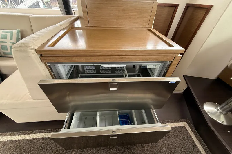 Slide: The Image of Interior of 2015 Fountaine Pajot Summerland 40 LC with open stainless steel drawers. - 76