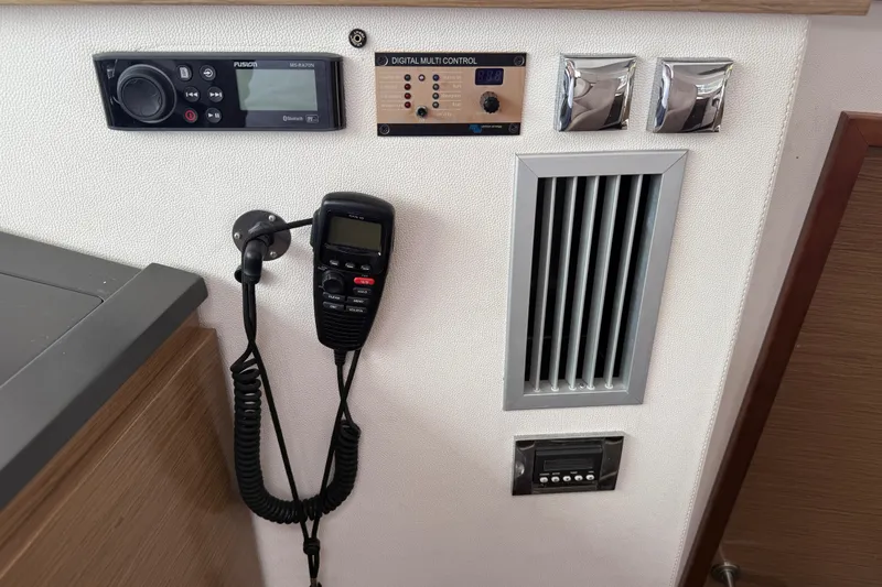 Slide: The Image of Control panel of 2015 Fountaine Pajot Summerland 40 LC with radio and digital controls. - 84