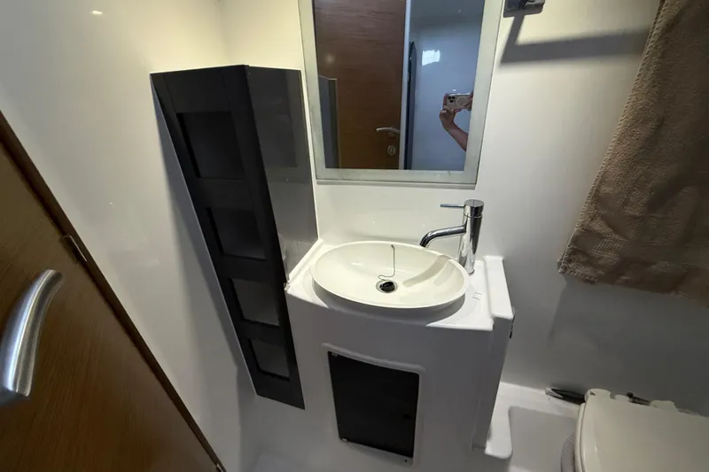 Slide: The Image of Bathroom interior of 2015 Fountaine Pajot Summerland 40 LC with sink and mirror. - 92