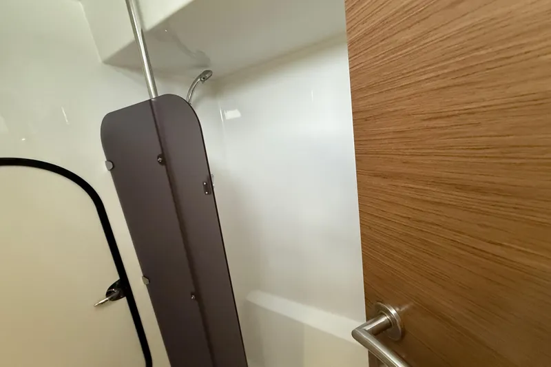 Slide: The Image of 2015 Fountaine Pajot Summerland 40 LC interior shower with wooden door and modern fixtures. - 94