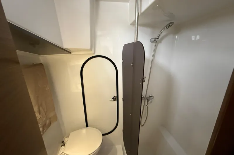 Slide: The Image of Bathroom interior of 2015 Fountaine Pajot Summerland 40 LC yacht, featuring shower and toilet. - 95