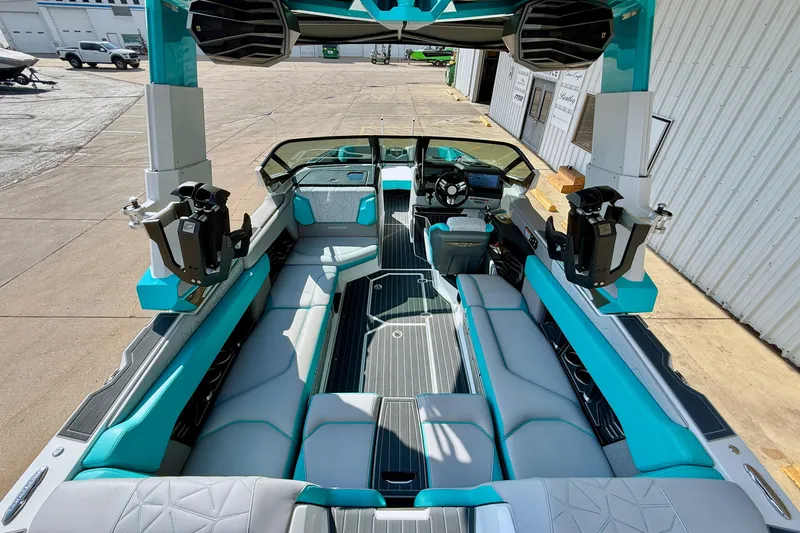 Slide: The Image of 2021 Nautique Super Air Nautique G23 Paragon interior with teal and gray seating. - 14