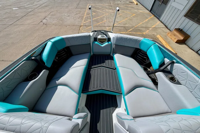 Slide: The Image of 2021 Nautique Super Air Nautique G23 Paragon interior with teal and gray seating. - 21