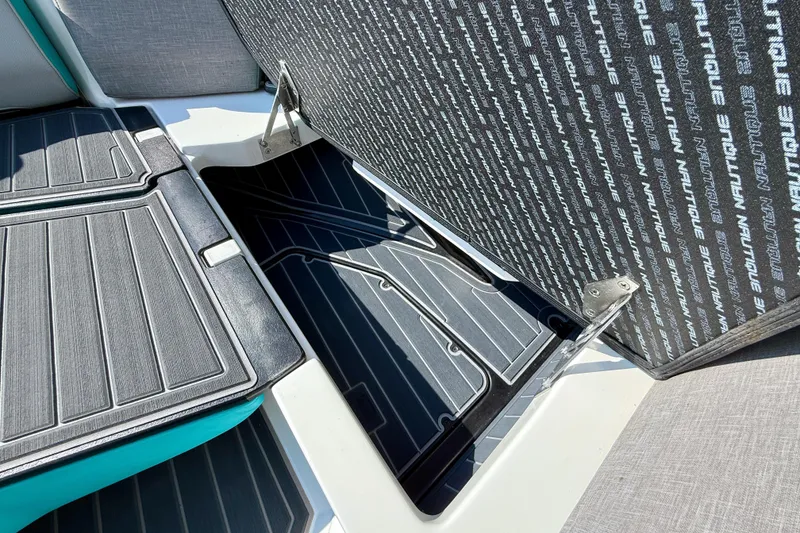Slide: The Image of 2021 Nautique Super Air Nautique G23 Paragon storage compartment with open hatch. - 22