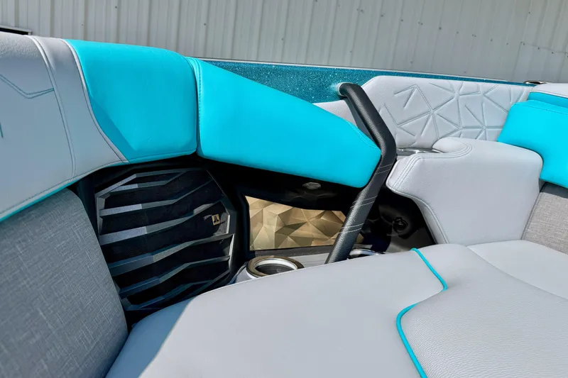Slide: The Image of 2021 Nautique Super Air Nautique G23 Paragon interior with turquoise and gray seating. - 25