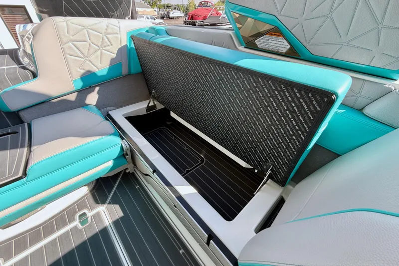 Slide: The Image of 2021 Nautique Super Air Nautique G23 Paragon interior with open storage compartment. - 28