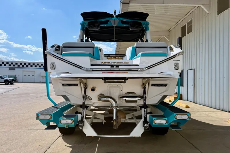 Slide: The Image of 2021 Nautique Super Air Nautique G23 Paragon boat, rear view, parked outdoors. - 3