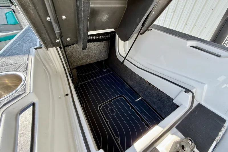 Slide: The Image of 2021 Nautique Super Air Nautique G23 Paragon storage compartment, open and spacious. - 30