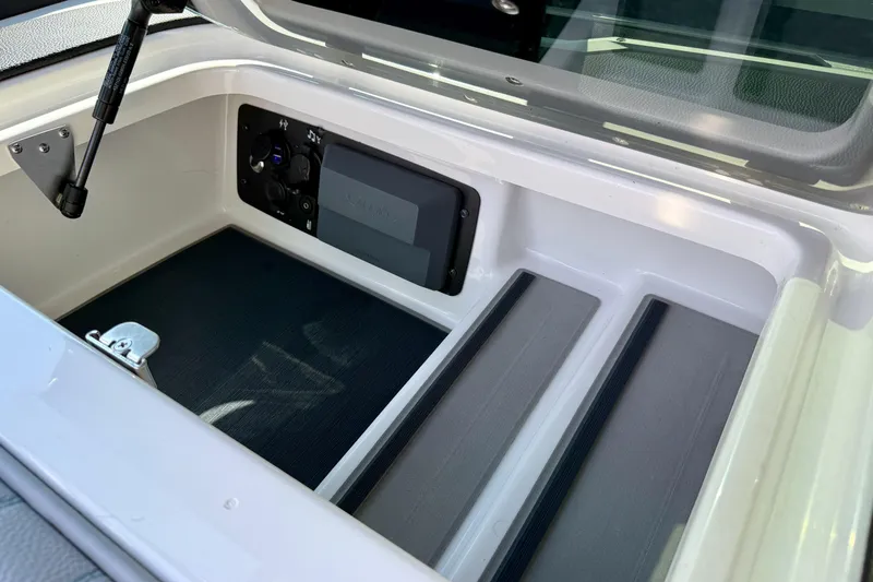 Slide: The Image of 2021 Nautique Super Air Nautique G23 Paragon storage compartment interior. - 35