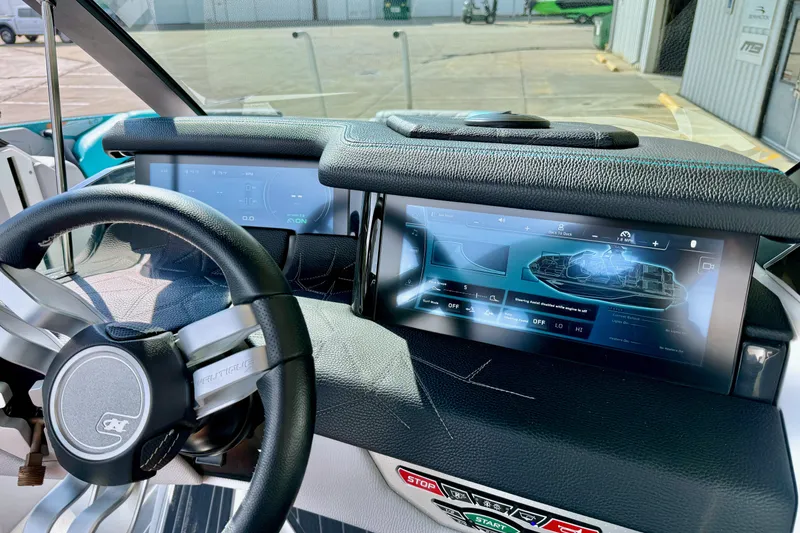 Slide: The Image of 2021 Nautique Super Air Nautique G23 Paragon dashboard with advanced digital displays. - 36