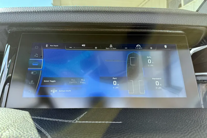 Slide: The Image of 2021 Nautique Super Air Nautique G23 Paragon dashboard display showing ballast and speed settings. - 37