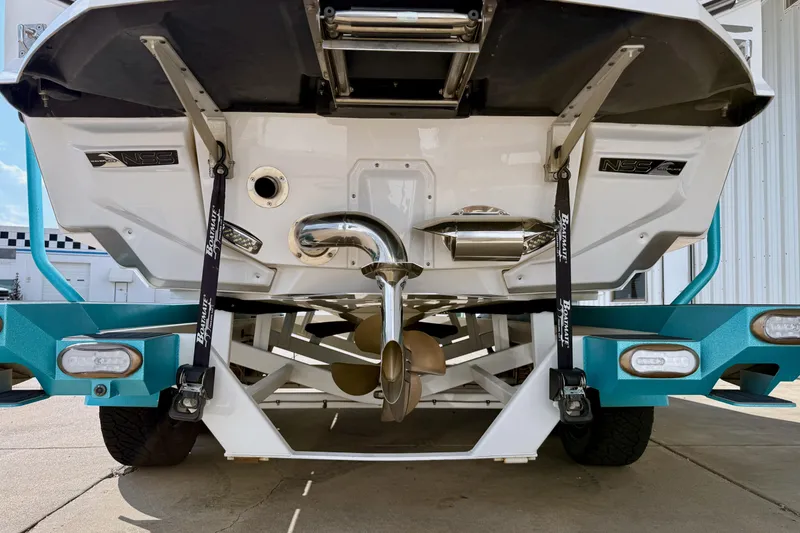 Slide: The Image of 2021 Nautique Super Air Nautique G23 Paragon boat rear view with trailer. - 4