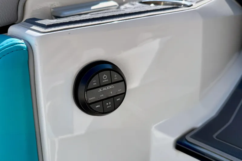 Slide: The Image of JL Audio control panel on 2021 Nautique Super Air Nautique G23 Paragon boat interior. - 48