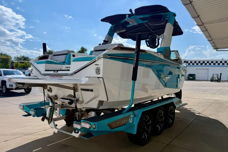 Slide: The Image of 2021 Nautique Super Air Nautique G23 Paragon boat on trailer, sunny day, outdoor setting. - 6