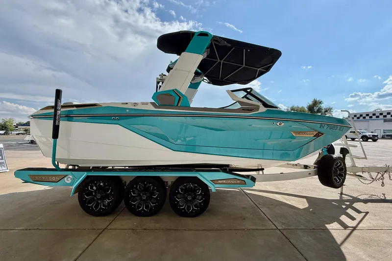 Slide: The Image of 2021 Nautique Super Air Nautique G23 Paragon boat on trailer, side view. - 7