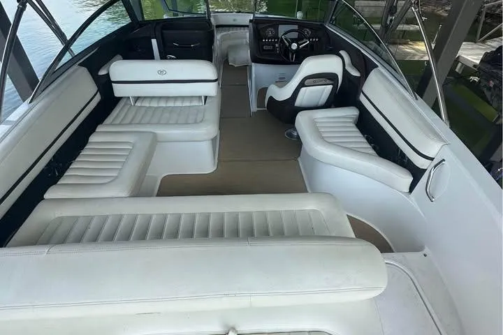 Slide: The Image of 2014 Cobalt R5 boat interior with white leather seating and steering console. - 4