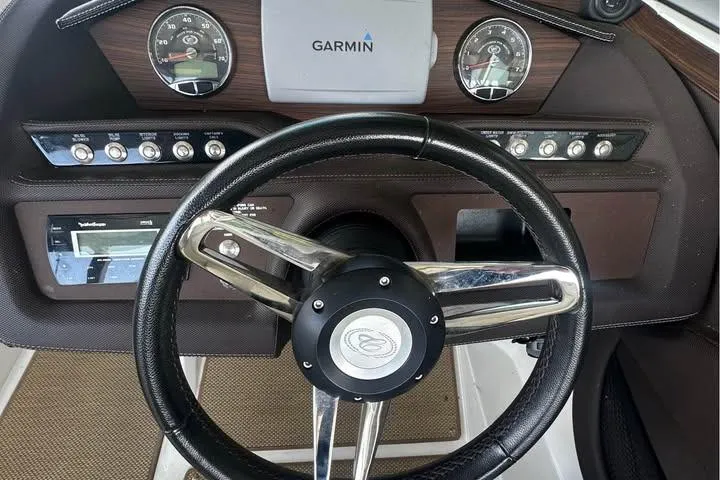 Slide: The Image of Steering wheel and dashboard of 2014 Cobalt R5 boat with Garmin navigation system. - 6