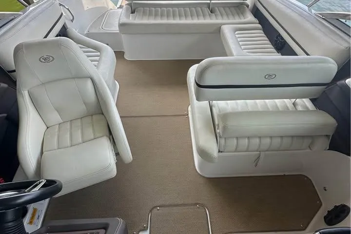 Slide: The Image of 2014 Cobalt R5 boat interior with white leather seating and beige carpet. - 7