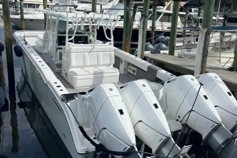 Slide: The Image of 2020 Invincible 40 Catamaran with quad engines docked at marina. - 10