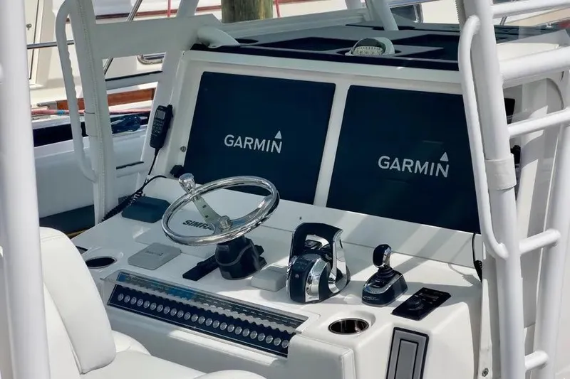 Slide: The Image of Control panel of 2020 Invincible 40 Catamaran with Garmin navigation displays. - 21