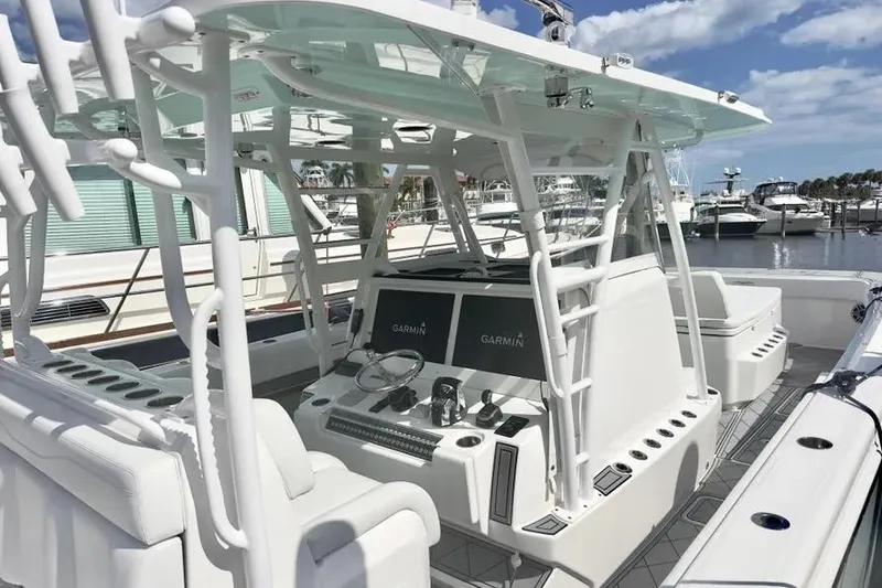 Slide: The Image of 2020 Invincible 40 Catamaran interior with advanced Garmin navigation system at marina. - 22