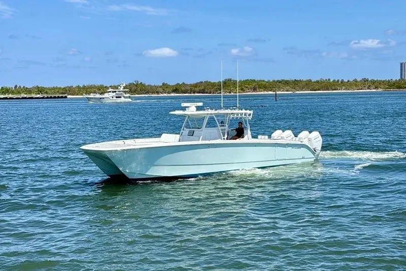 Slide: The Image of 2020 Invincible 40 Catamaran cruising on a sunny day in open waters. - 3