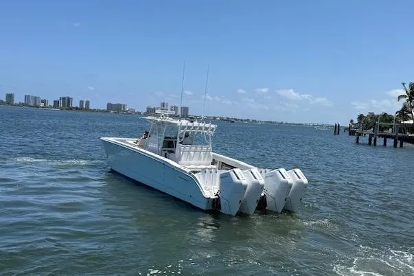 Slide: The Image of 2020 Invincible 40 Catamaran with four engines cruising on a sunny day. - 6