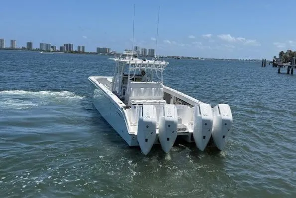 Slide: The Image of 2020 Invincible 40 Catamaran with four engines cruising on a sunny day. - 8