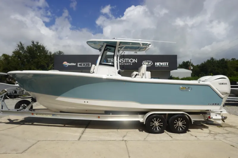 The Image of 2026 Sea Hunt Gamefish 27 Coffin Box boat on trailer, side view, outdoors. - 0