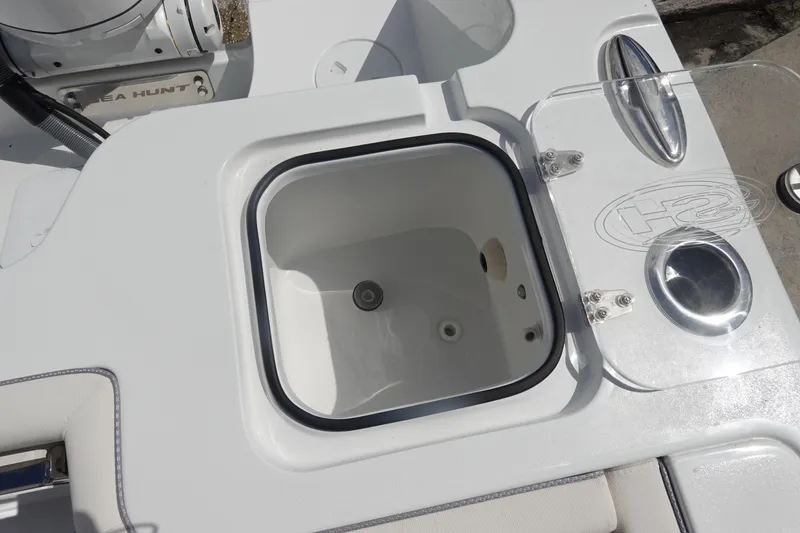Slide: The Image of 2026 Sea Hunt Gamefish 27 Coffin Box boat detail, featuring a built-in storage compartment. - 12