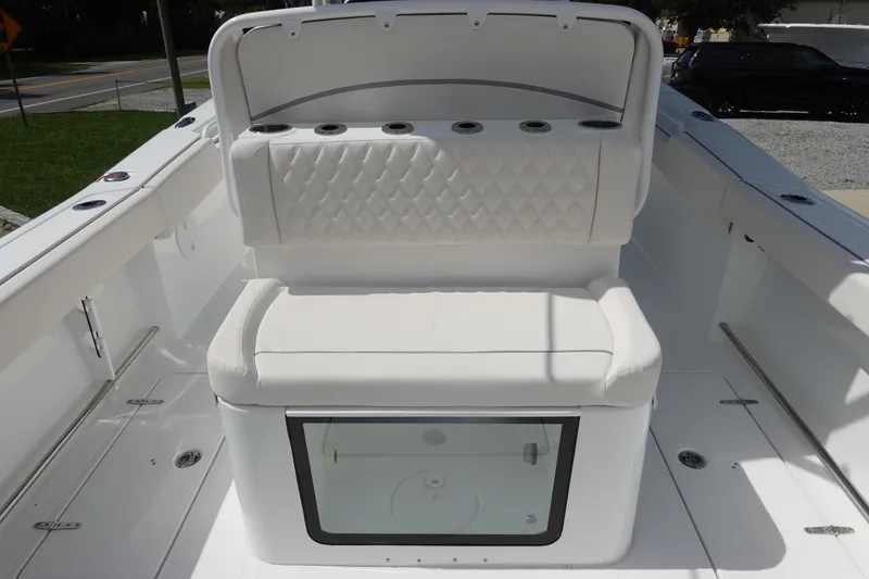 Slide: The Image of 2026 Sea Hunt Gamefish 27 Coffin Box interior with cushioned seating and storage. - 13