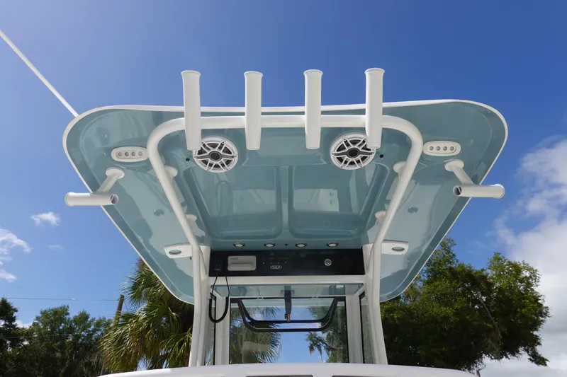 Slide: The Image of 2026 Sea Hunt Gamefish 27 Coffin Box boat top view with rod holders and speakers. - 16