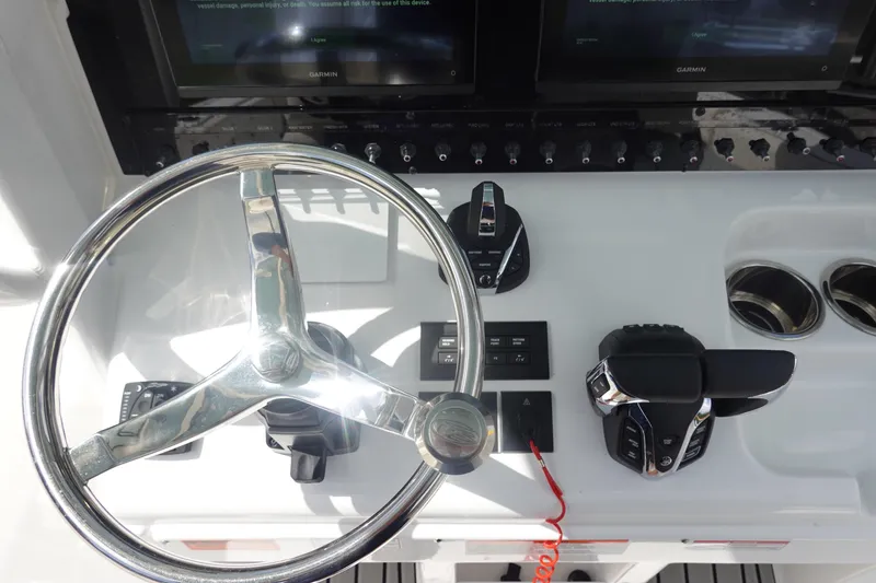 Slide: The Image of Steering console of 2026 Sea Hunt Gamefish 27 Coffin Box with modern controls and displays. - 21