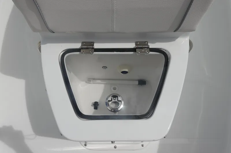 Slide: The Image of 2026 Sea Hunt Gamefish 27 Coffin Box interior view, featuring a clean, white compartment. - 26