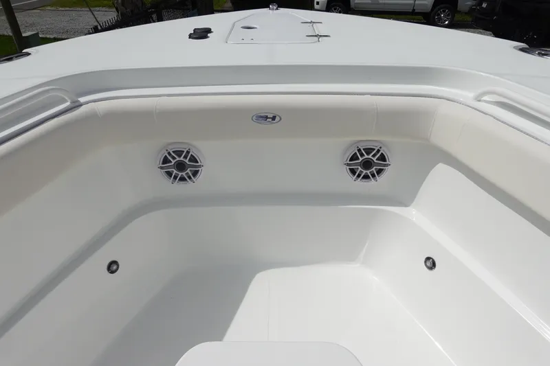 Slide: The Image of 2026 Sea Hunt Gamefish 27 Coffin Box boat interior with speakers and seating area. - 28