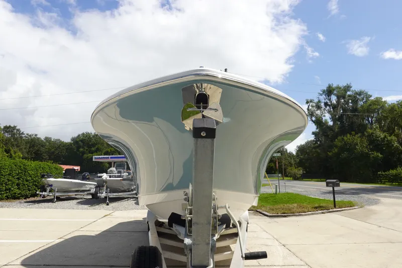 Slide: The Image of 2026 Sea Hunt Gamefish 27 Coffin Box boat on trailer, sunny day, outdoor setting. - 3