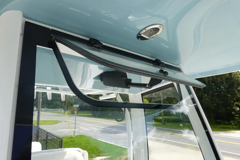 Slide: The Image of 2026 Sea Hunt Gamefish 27 Coffin Box boat window detail with open hatch. - 31